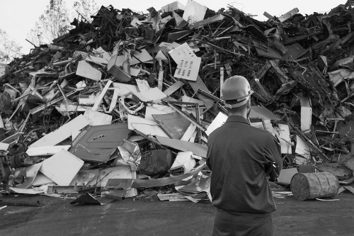 Construction site with builders managing waste in South London